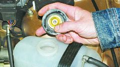 How to check the surge tank cap