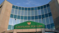 How many percent of the shares of Sberbank of Russia belongs to the state