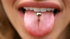 Than remove the tumor from the tongue after piercing 