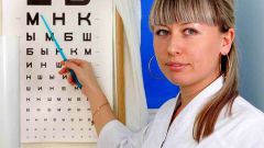 As an optometrist checks vision