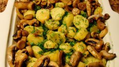 Young potatoes with mushrooms in the oven
