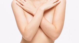 What determines breast size in women