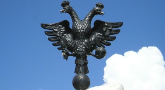 Why is the Russian coat of arms double-headed eagle 