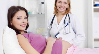 Что делать, если при беременности боли в животе, как будто во время месячных