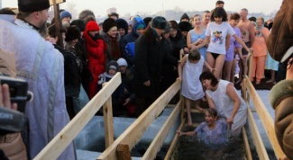 To what time it is customary to plunge into the ice-hole on Epiphany