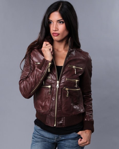 Man holding a leather jacket