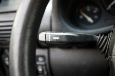 The lever of turn indicators is located under the steering wheel
