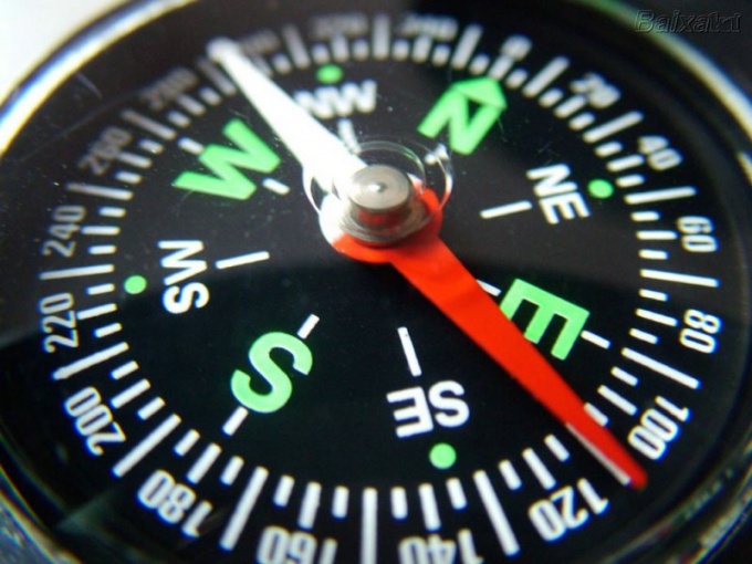 Where the red arrow shows the compass