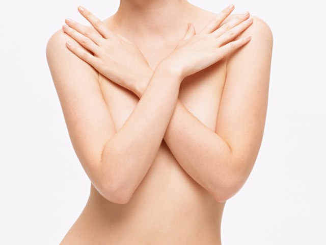 What determines breast size in women