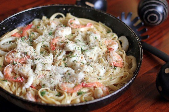 The secrets of Italian cuisine: pasta "Fettuccine Alfredo" with shrimp