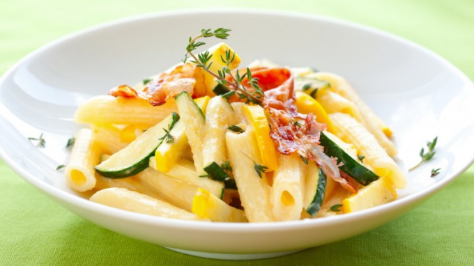 A side dish of pasta with vegetables