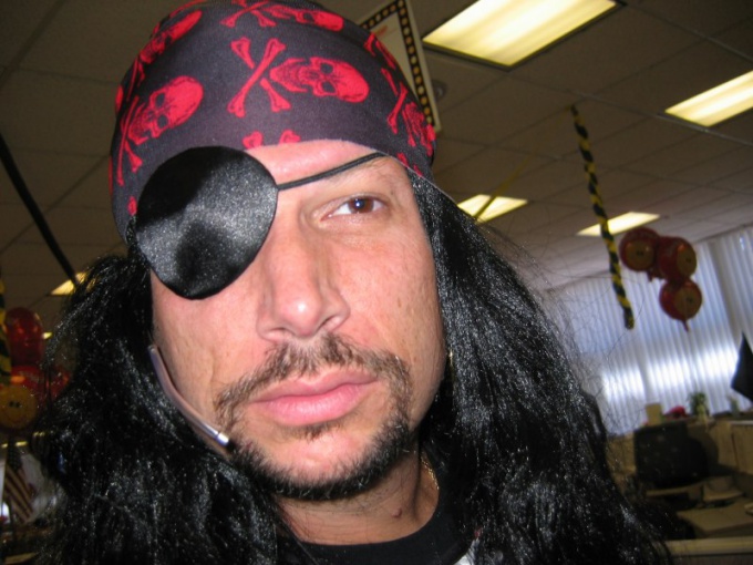 Pirate suit and a black patch on one eye