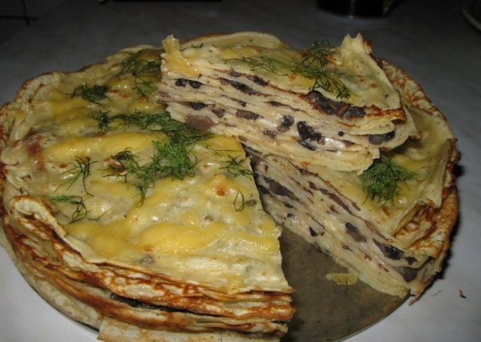 Pancake cake with mushrooms and cheese